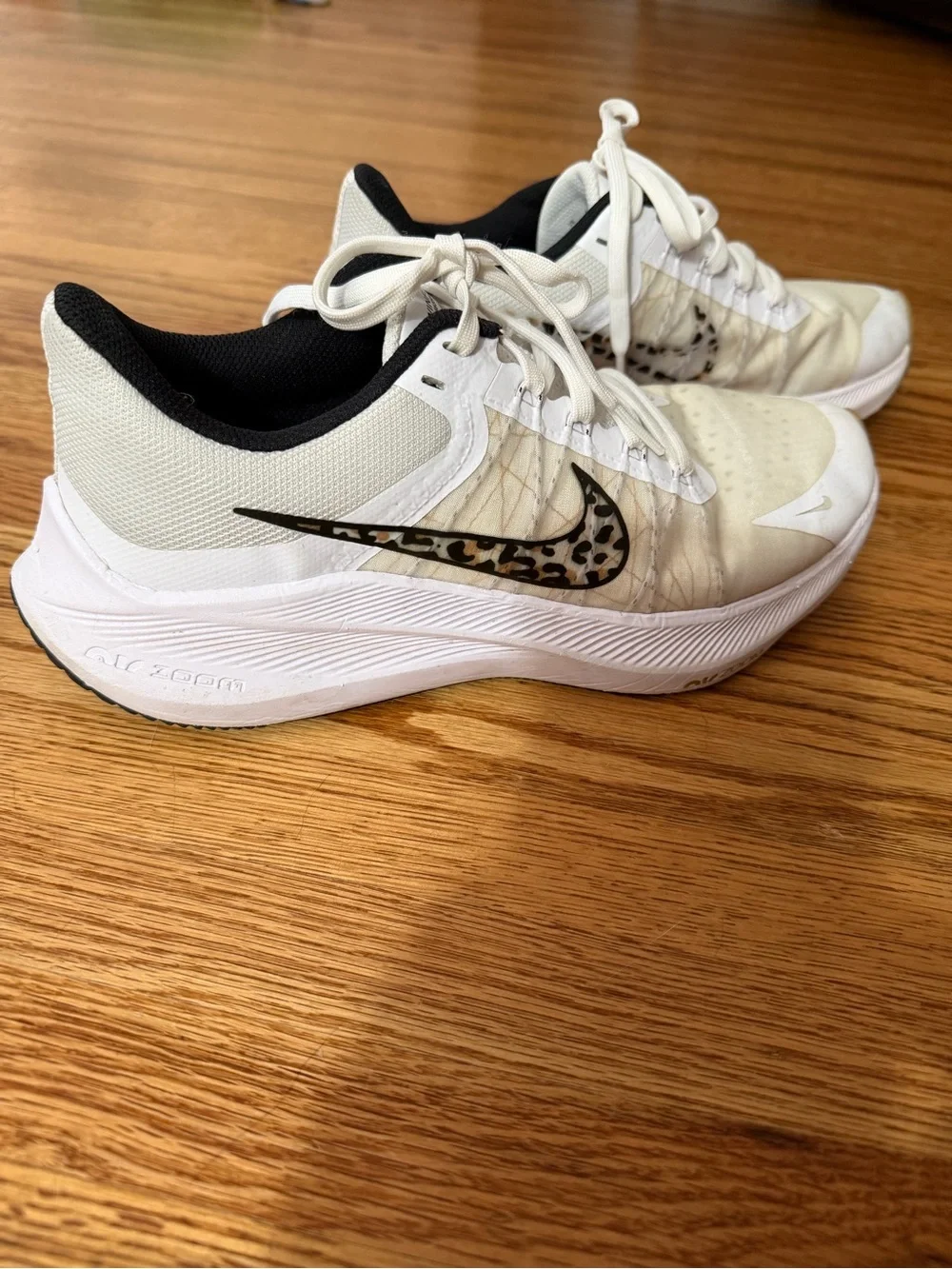 Nike Women’s White Athletic Sneakers with Leopard-Print Swoosh